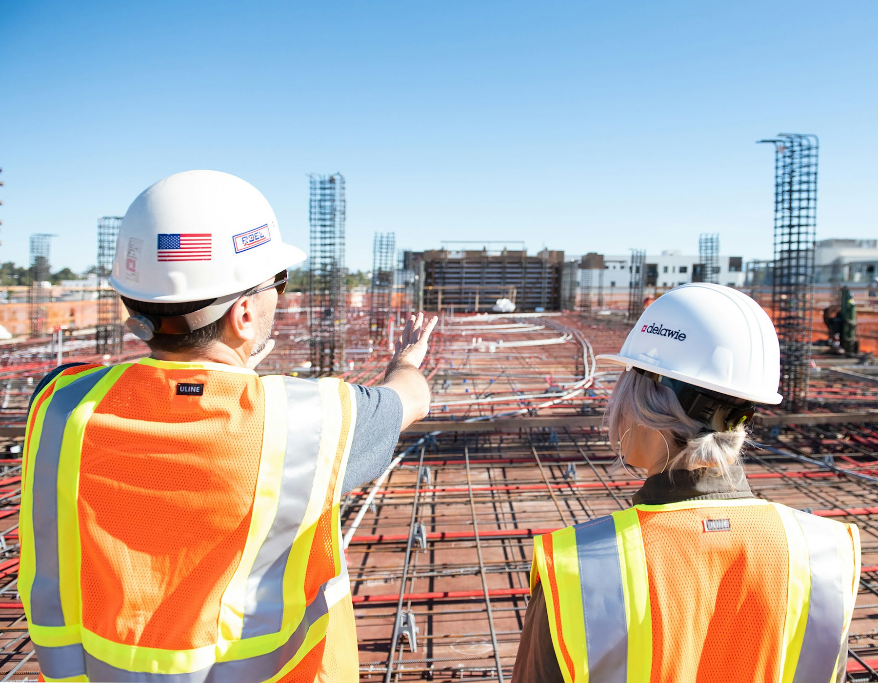Construction professionals reviewing an active job site